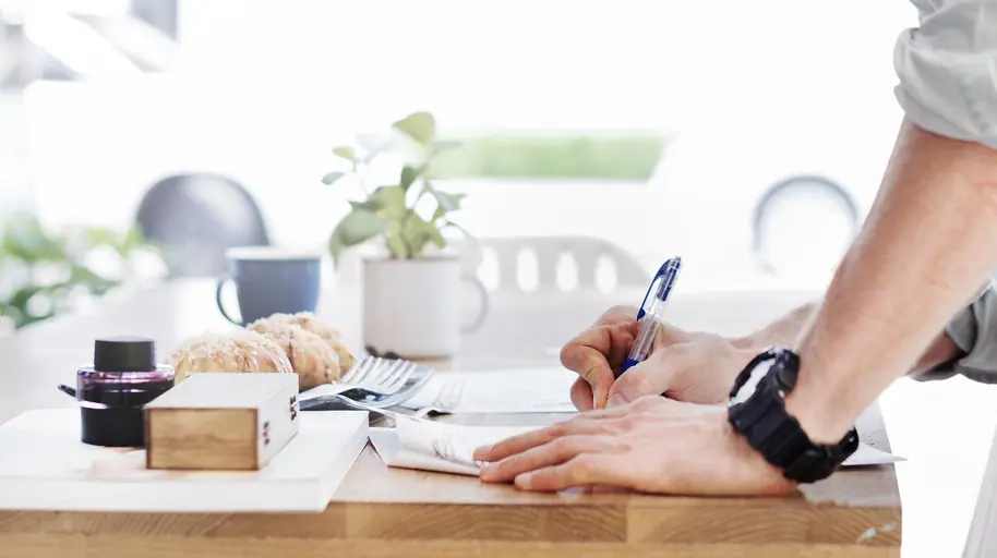 Writing at a tidy desk